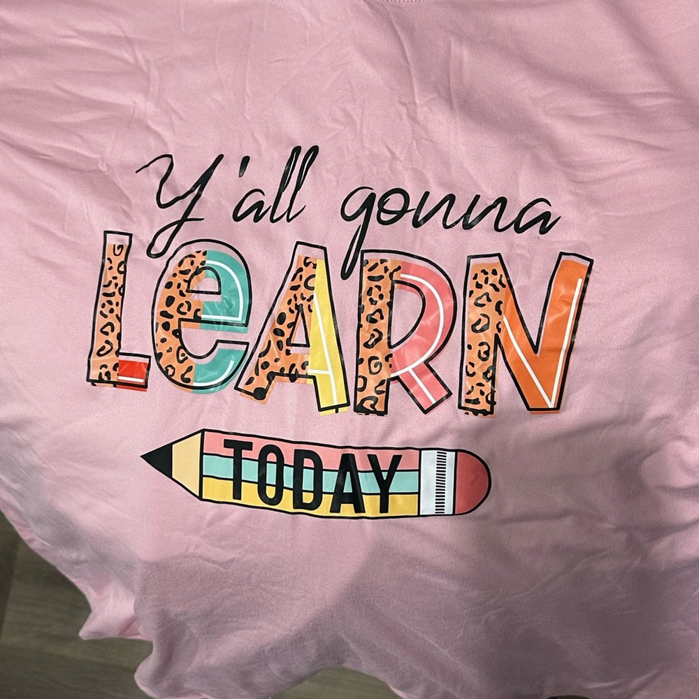 Pink Graphic Tee with Colorful 'Learn' Design